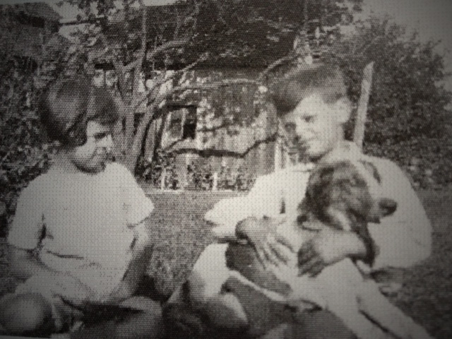 Me around age 7 with my brother Ernie & dog Sandy